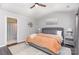 Comfortable main bedroom featuring hardwood floors, a gray bed frame, and matching bedside tables at 2945 Duvalla Ave, Charlotte, NC 28209