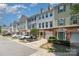 Charming townhomes boast brick accents, garage parking, and meticulously maintained landscaping in a desirable neighborhood at 2945 Duvalla Ave, Charlotte, NC 28209