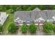 Aerial view of multiple two-story townhomes with lush green landscaping at 3237 Yarmouth Ln, Gastonia, NC 28056