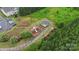 Aerial view of a playground, gazebo, sidewalks, landscaping, and trees at 3237 Yarmouth Ln, Gastonia, NC 28056