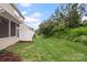 Large backyard with nice landscaping and a screened in porch at 3237 Yarmouth Ln, Gastonia, NC 28056