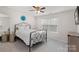 Cozy bedroom with ceiling fan, neutral carpet, and large window providing natural light at 3237 Yarmouth Ln, Gastonia, NC 28056