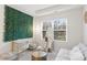 Bright bedroom with a decorative green wall, desk area, and a comfortable seating space at 3237 Yarmouth Ln, Gastonia, NC 28056