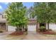 Attractive two-story townhome with a brick facade and a one-car garage at 3237 Yarmouth Ln, Gastonia, NC 28056