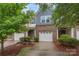 Charming two-story townhome with a brick facade and a one-car garage at 3237 Yarmouth Ln, Gastonia, NC 28056