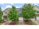 Inviting two-story townhome featuring a brick facade and a one-car garage at 3237 Yarmouth Ln, Gastonia, NC 28056
