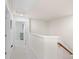 Upstairs hallway features neutral carpet, white walls and trim, and access to the attic at 3237 Yarmouth Ln, Gastonia, NC 28056