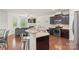 Open concept kitchen featuring stainless appliances and granite countertops overlooking the living area at 3237 Yarmouth Ln, Gastonia, NC 28056