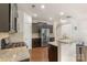 Modern kitchen with stainless steel appliances, granite counters, and a breakfast bar at 3237 Yarmouth Ln, Gastonia, NC 28056