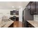 The kitchen features stainless steel appliances, granite countertops, and rich dark wood flooring at 3237 Yarmouth Ln, Gastonia, NC 28056