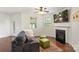 Comfortable living room with fireplace, plenty of natural light and inviting furniture at 3237 Yarmouth Ln, Gastonia, NC 28056