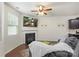 Relaxing living room setup with fireplace, ceiling fan, and TV above mantle at 3237 Yarmouth Ln, Gastonia, NC 28056