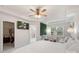 Inviting main bedroom featuring a ceiling fan, ensuite bathroom, and walk-in closet entrance at 3237 Yarmouth Ln, Gastonia, NC 28056