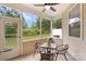 Relaxing screened porch with outdoor seating and views of the backyard and lush greenery at 3237 Yarmouth Ln, Gastonia, NC 28056