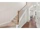 Bright foyer featuring hardwood floors and staircase with white trim at 3237 Yarmouth Ln, Gastonia, NC 28056