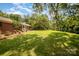 Expansive backyard with lush green grass, mature trees, and plenty of space for outdoor activities at 3250 Celanese Rd, Rock Hill, SC 29732