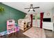 Bright bedroom featuring a loft bed, green accent wall, and ample natural light at 3250 Celanese Rd, Rock Hill, SC 29732