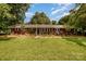Charming brick home with a well-manicured lawn, mature trees, and inviting curb appeal at 3250 Celanese Rd, Rock Hill, SC 29732