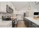 Well-equipped kitchen featuring white cabinets, stainless steel appliances, and a functional layout at 3250 Celanese Rd, Rock Hill, SC 29732