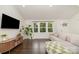 Bright living room featuring large windows, hardwood floors, and stylish furnishings at 3250 Celanese Rd, Rock Hill, SC 29732