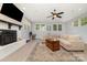 Cozy living room with a fireplace, ample seating, and natural light at 3250 Celanese Rd, Rock Hill, SC 29732