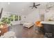 Comfortable living room with vaulted ceiling, hardwood floors, and views of the kitchen at 3250 Celanese Rd, Rock Hill, SC 29732