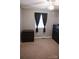 Simple bedroom with carpeted floors, ample natural light, and modern black dressers at 332 Daybrook Dr, Landis, NC 28088