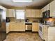 Bright kitchen featuring ample counter space, and white appliances at 332 Daybrook Dr, Landis, NC 28088