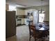 Bright kitchen featuring white cabinets, stainless steel appliances, and an adjacent dining area at 332 Daybrook Dr, Landis, NC 28088
