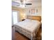 Cozy main bedroom boasting natural light, a ceiling fan, and a comfortable queen-sized bed at 332 Daybrook Dr, Landis, NC 28088