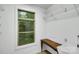 Closet with bright window, utility sink, ample shelving, and laminate flooring at 3333 Roberta Rd, Concord, NC 28027