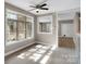 Sunny dining area with large windows and open access to the living room at 3333 Roberta Rd, Concord, NC 28027