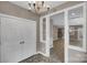 Bright entryway featuring tiled floors, a chandelier, closet and an open view into other rooms at 3333 Roberta Rd, Concord, NC 28027