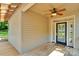 Inviting front porch with ceiling fan and a beautiful front door with glass panels at 3333 Roberta Rd, Concord, NC 28027