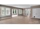 Bright living area features hardwood floors and large windows offering plenty of natural light at 3333 Roberta Rd, Concord, NC 28027