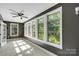 Lots of bright natural light floods into the sunroom from the many windows at 3333 Roberta Rd, Concord, NC 28027