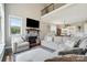 Comfortable living room with a stone fireplace, plush seating, and an open view to the dining area at 3340 Emerald Pointe Ct, Monroe, NC 28110