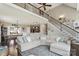Spacious living room featuring a large sectional sofa, hardwood floors, and an open layout at 3340 Emerald Pointe Ct, Monroe, NC 28110