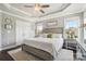 Relaxing main bedroom offers a ceiling fan, hardwood floors and generous natural light at 3340 Emerald Pointe Ct, Monroe, NC 28110