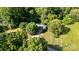 Aerial view showing the home nicely placed among mature trees at 3420 Long Ferry Rd, Salisbury, NC 28146