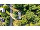 An aerial view showcasing the home, surrounding greenery, and the adjacent road at 3420 Long Ferry Rd, Salisbury, NC 28146