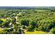 Aerial view of the property and surrounding area with mature trees at 3420 Long Ferry Rd, Salisbury, NC 28146