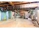 Unfinished basement features open layout, shower, and wood stove at 3420 Long Ferry Rd, Salisbury, NC 28146