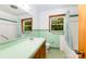 Bathroom with retro green tile, window, and tub/shower combo at 3420 Long Ferry Rd, Salisbury, NC 28146