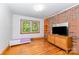 Charming bedroom with hardwood floors and brick accent wall at 3420 Long Ferry Rd, Salisbury, NC 28146