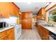The eat-in kitchen has wood cabinets, stainless steel sink, and vinyl floors at 3420 Long Ferry Rd, Salisbury, NC 28146