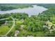 Aerial view of the home nestled in a lush, green forest with a lake nearby at 40 Old Rd, Taylorsville, NC 28681