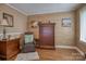 Cozy bedroom showcases a decorative accent wall, dresser, and a comfortable chair for a relaxing retreat at 40 Old Rd, Taylorsville, NC 28681