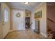 Welcoming foyer with tiled floors, decorative wreath, and view to the staircase at 40 Old Rd, Taylorsville, NC 28681