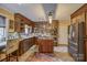 Traditional kitchen featuring stained wood cabinetry, stainless steel appliances, an island, and tile flooring at 40 Old Rd, Taylorsville, NC 28681